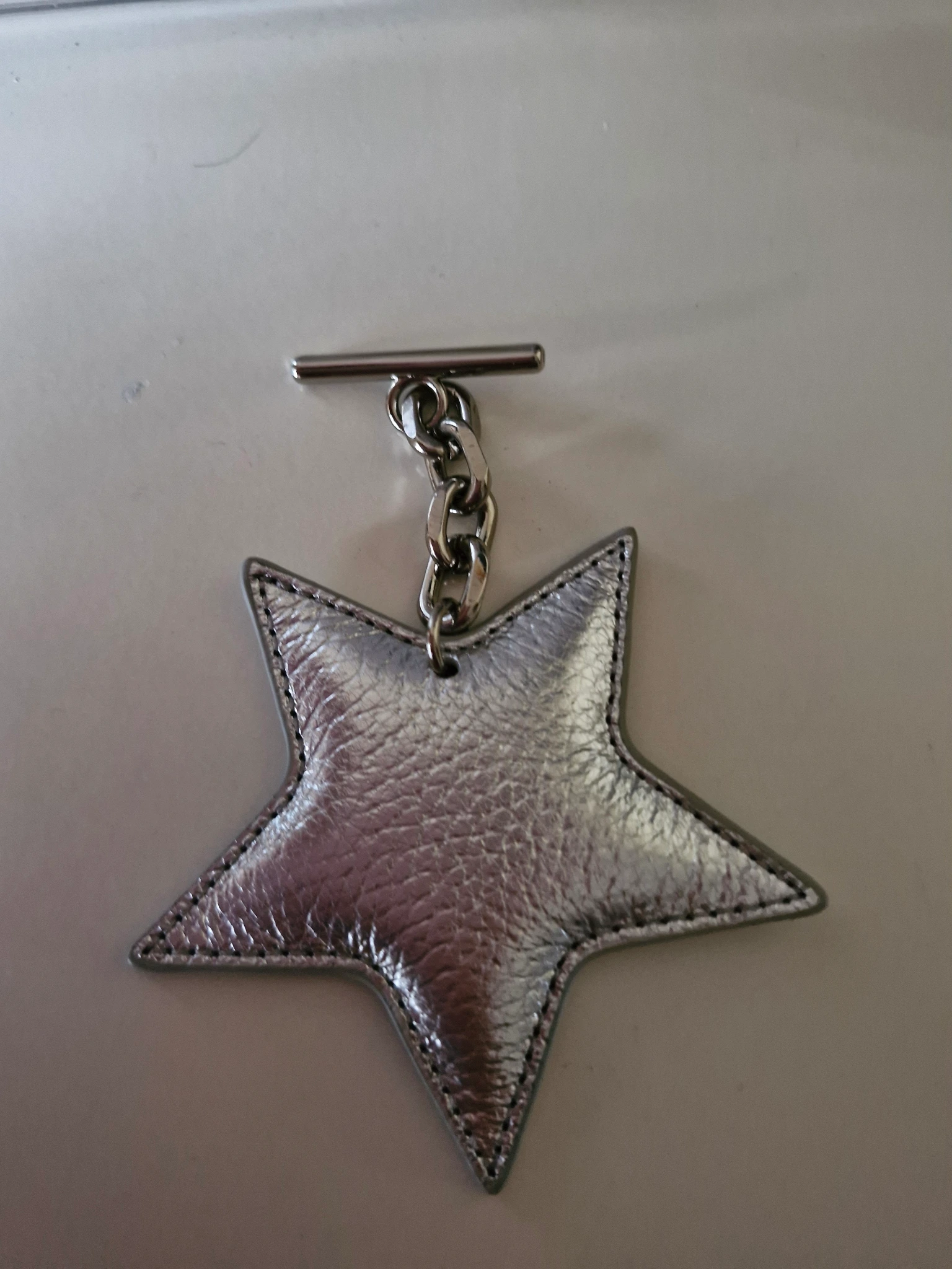 Silver star tbar tassel shw 