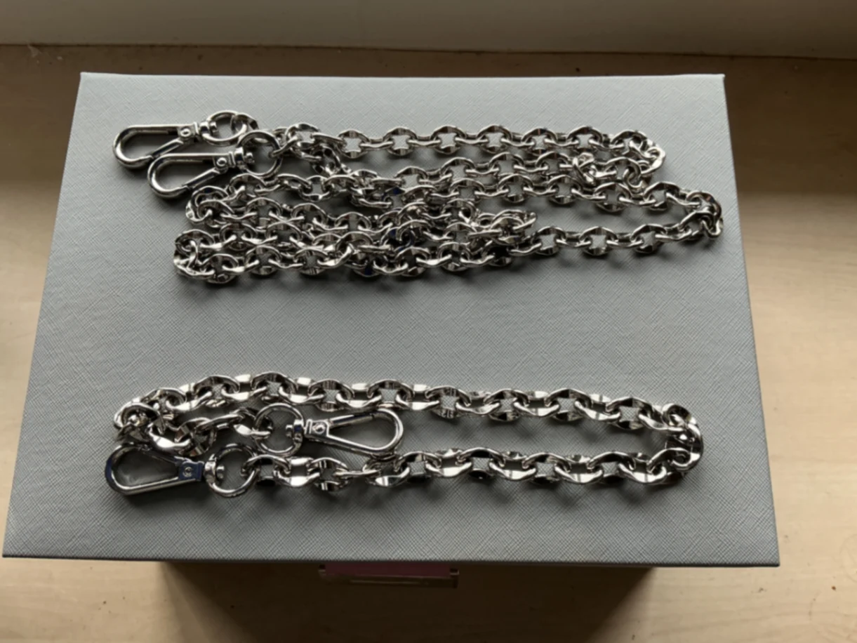 Two silver chains , one small one large 