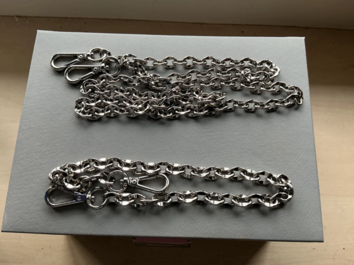 Two silver chains , one small one large 