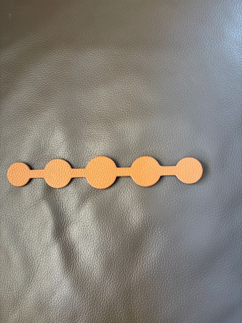 Classic Deco Strip Shaped in tan with silver poppers