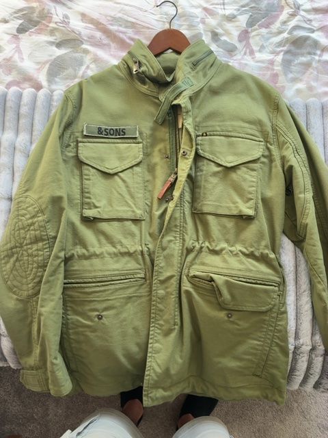  &SONS military-style field jacket in a faded sage/olive green.