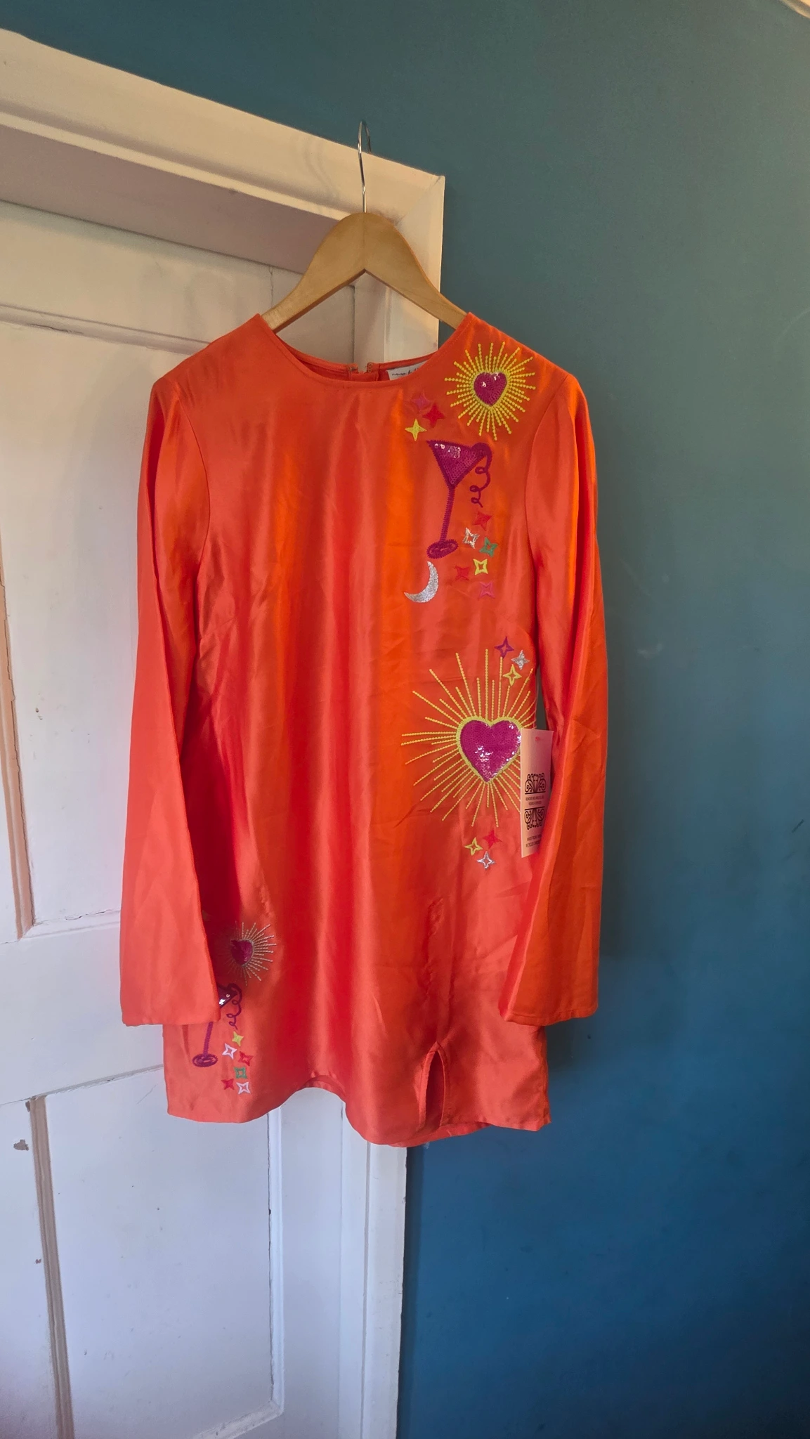 Beautiful orange dress heart and cocktail detail 