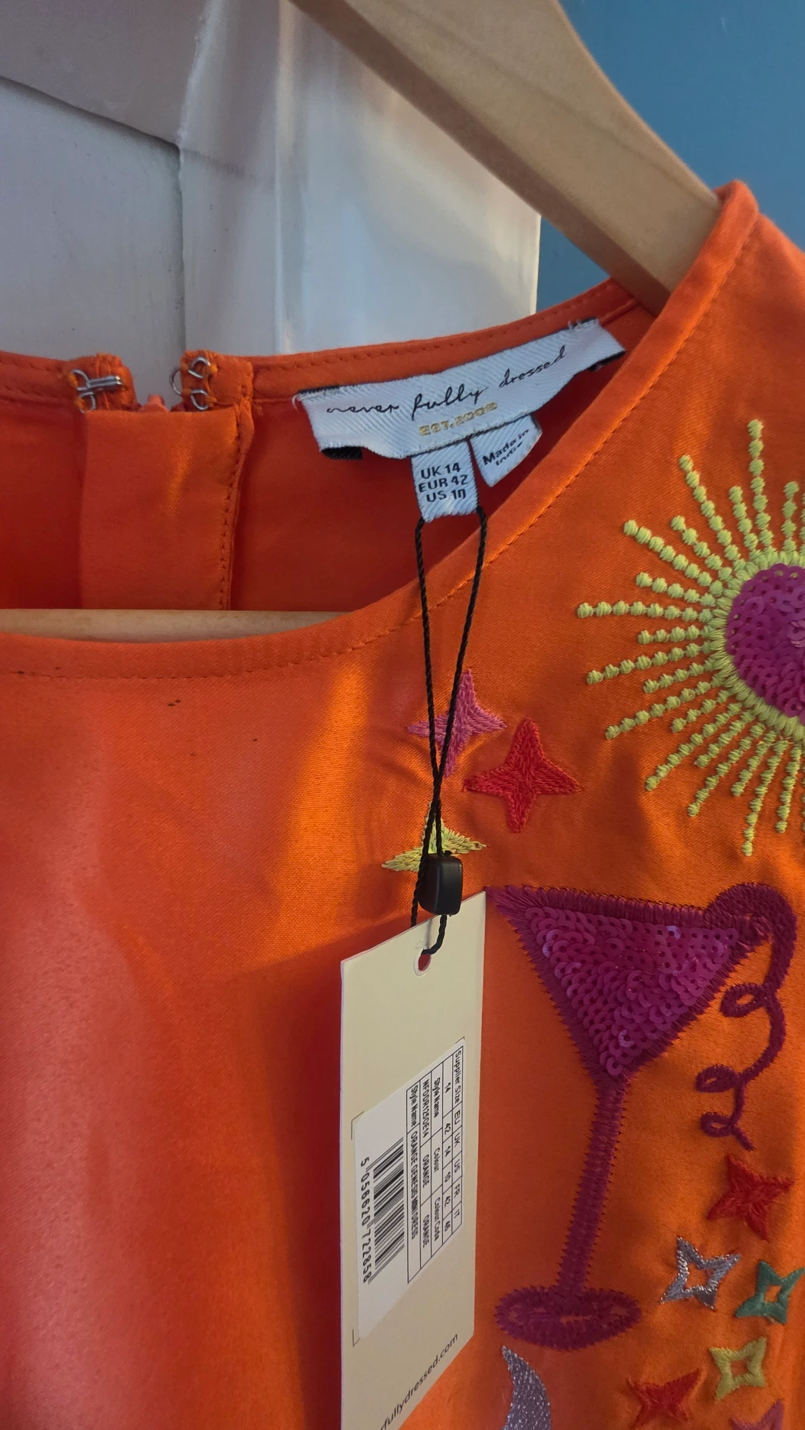 Beautiful orange dress heart and cocktail detail 