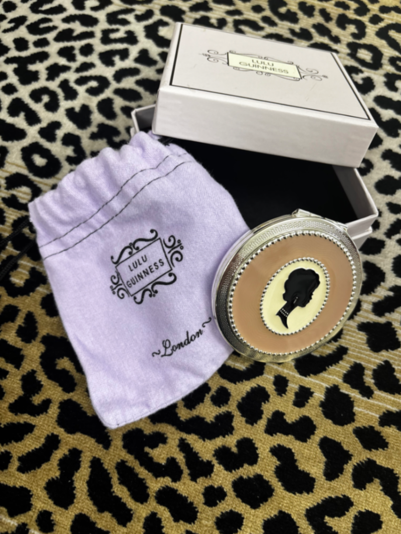 Cameo silhouette mirror and magnifying mirror compact