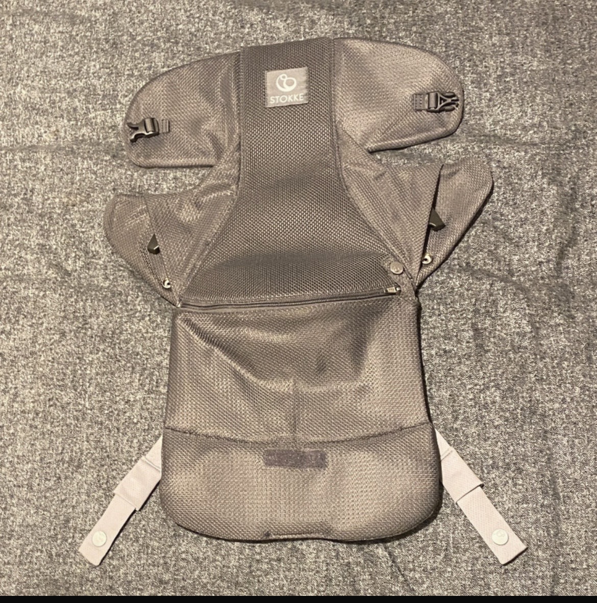 Brand new Stokke baby carrier front facing.