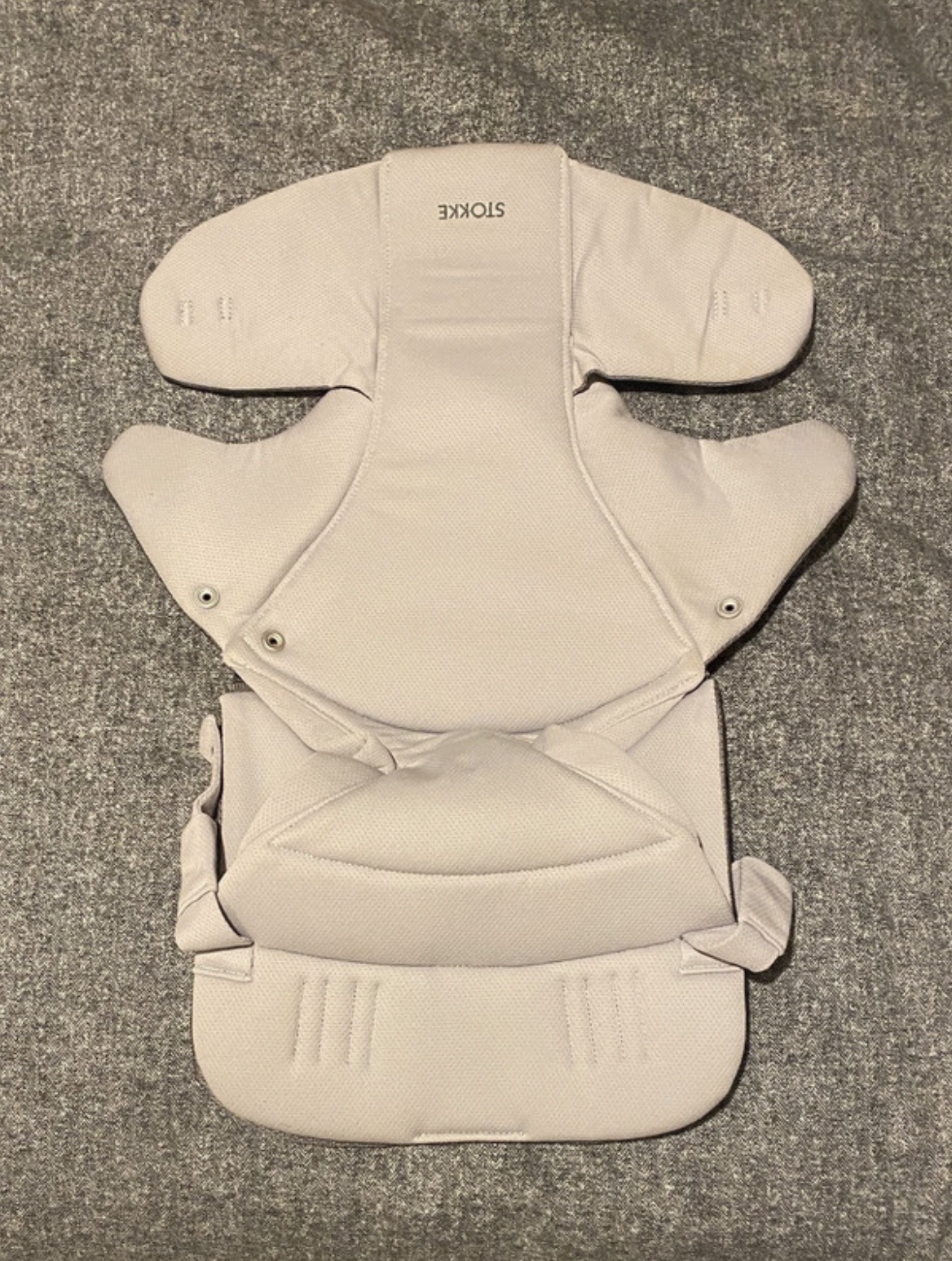 Brand new Stokke baby carrier front facing.
