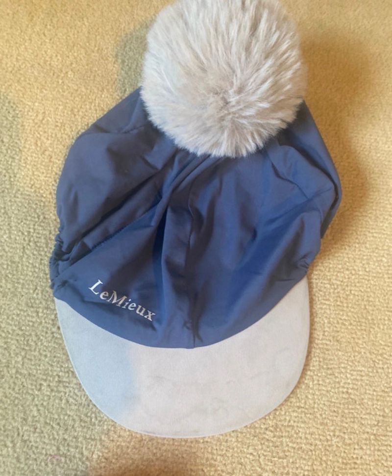Blue hat silk with pom pom